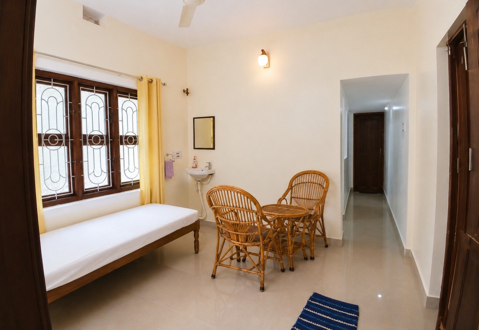 Lotus Apartment living room with single bed and sitting area