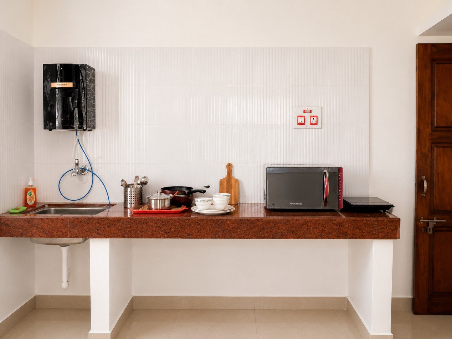 Kitchen counter with sink and induction cooktop